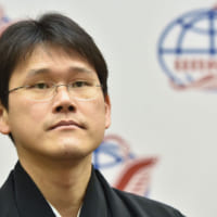 記者会見での金井宇宙飛行士（Image Credit：NASA）